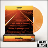 Starsailor - Love Is Here: 25th Anniversary Edition (Now Spinning Re-Spun 001) (Translucent Orange Vinyl) (Limited to 200 Copies w/ Signed & Hand-Numbered Slice) + Wooden Block Record Display Stand